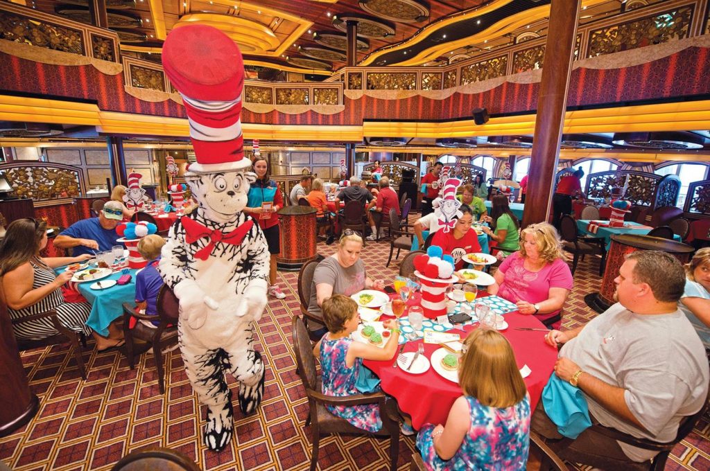The Cat in the Hat walks amid cruise diners during the "The Green Eggs and Ham Breakfast with the Cat in the Hat and Friends" onboard the Carnival Freedom. The featured dining opportunity with characters out of Dr. Seuss' books is staged in the Carnival Freedom's Chic Dining Room and offers playful foods straight from Dr. Seuss’s imagination – green eggs and ham, moose juice and goose juice, along with colorful fruit and pancake stacks, funky French toast and more. (Andy Newman/Carnival Cruise Lines)