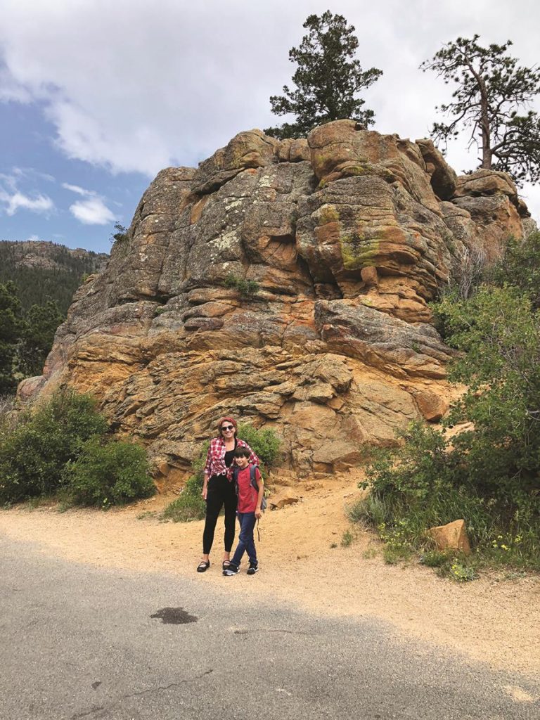 Kathy Nolan and Jack Bearden stop to admire a huge boulder while traveling on Trail Ridge Road near the Continental Divide.