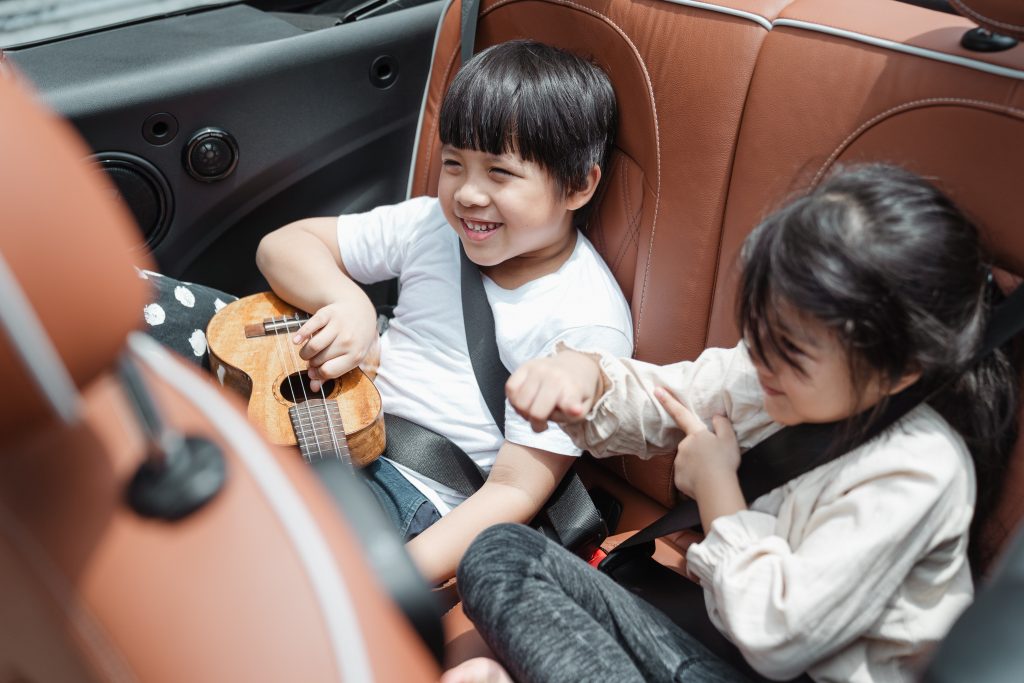 It is important to pack entertainment options to keep your family occupied during longer stretches of driving. Photo by Ketut Subivanto from Pexels