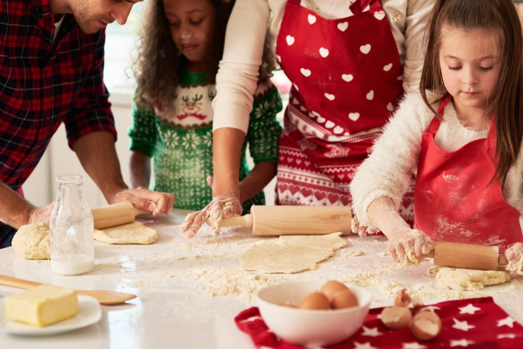 Baking holiday treats together. Photo credit Freepik